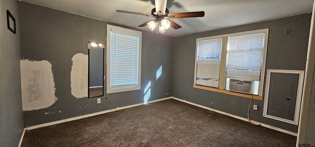 carpeted empty room featuring electric panel, cooling unit, and ceiling fan