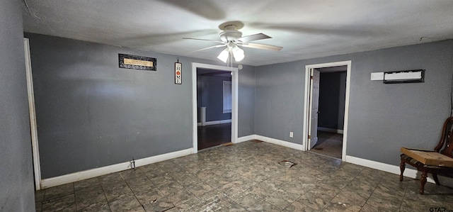 spare room with ceiling fan