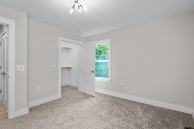 601 N 4th St, Crockett, TX 75835 - unfurnished bedroom featuring carpet, baseboards, a spacious closet, and a closet