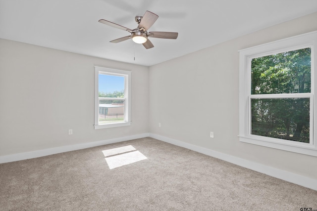 601 N 4th St, Crockett, TX 75835 - unfurnished room with carpet floors, baseboards, and a ceiling fan