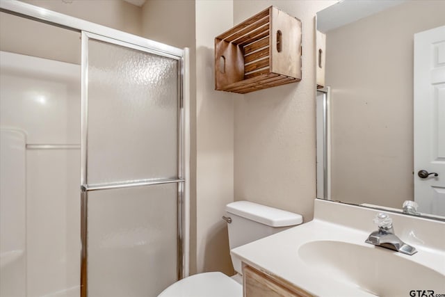 141 Green Mesa Ln, Holly Lake Ranch, TX 75765 - bathroom featuring a stall shower, toilet, and vanity