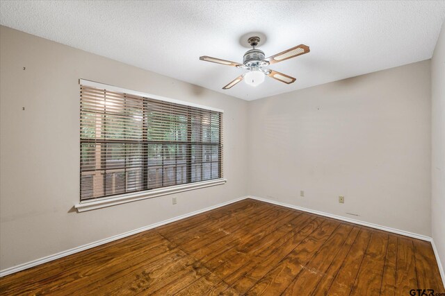 141 Green Mesa Ln, Holly Lake Ranch, TX 75765 - empty room featuring wood finished floors, ceiling fan, baseboards, and a textured ceiling