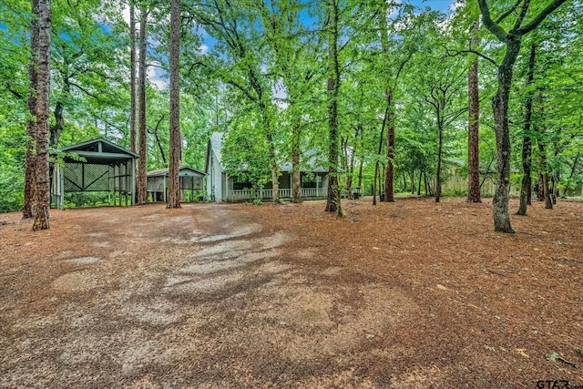 141 Green Mesa Ln, Holly Lake Ranch, TX 75765 - view of yard with a detached carport