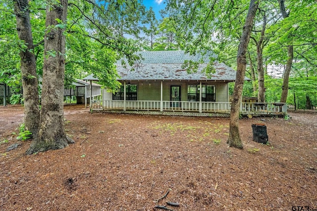 141 Green Mesa Ln, Holly Lake Ranch, TX 75765 - view of front facade with a porch and roof with shingles