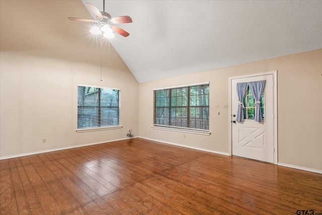 141 Green Mesa Ln, Holly Lake Ranch, TX 75765 - spare room featuring plenty of natural light, ceiling fan, wood finished floors, baseboards, and lofted ceiling