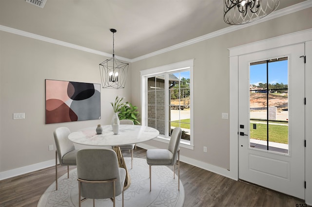 dining room featuring crown molding, dark hardwood / wood-style flooring, and a healthy amount of sunlight