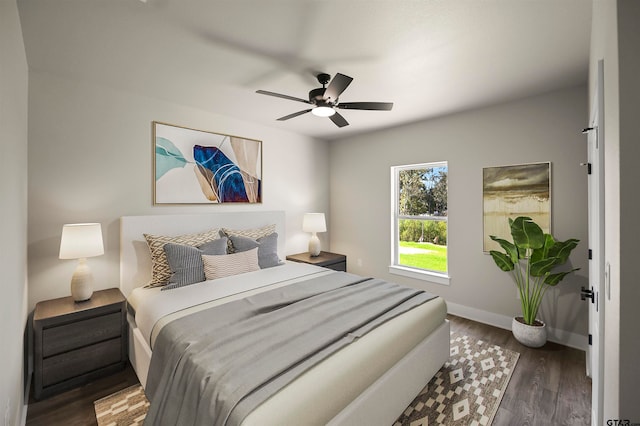 bedroom featuring ceiling fan and dark hardwood / wood-style flooring