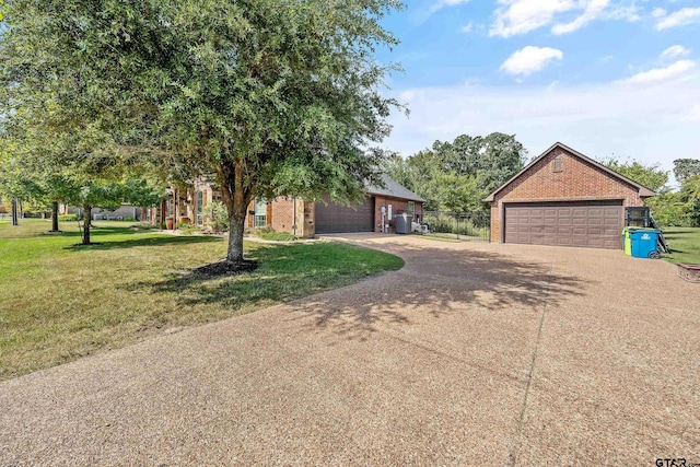 view of front of home featuring a garage and a front yard