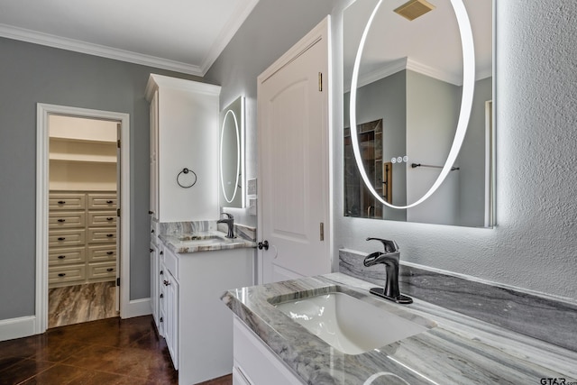 bathroom featuring vanity and crown molding