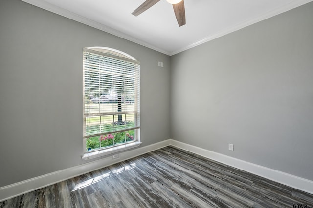 spare room featuring dark hardwood / wood-style floors, crown molding, and ceiling fan