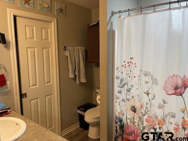 bathroom featuring vanity and toilet