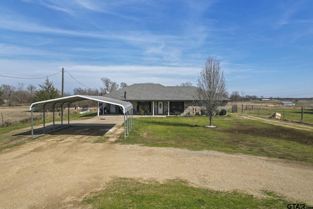 view of front of house featuring a front yard and a carport