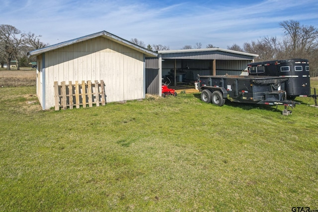 view of outbuilding with a yard