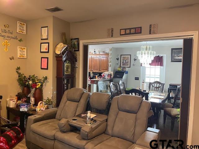 living room featuring a notable chandelier