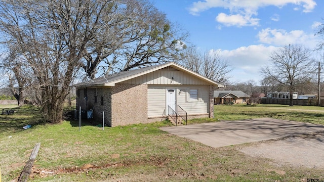 view of outbuilding featuring driveway