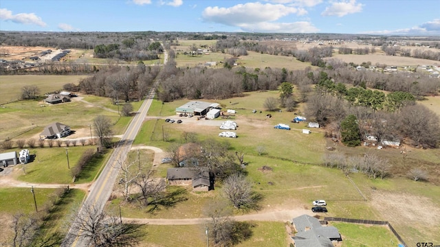 birds eye view of property with a rural view