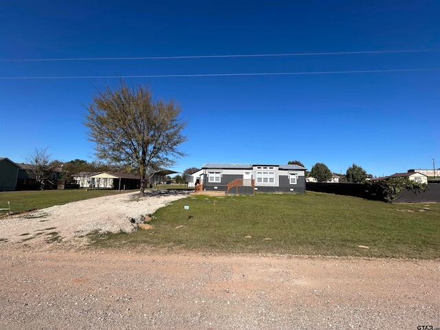 view of front of home featuring a front lawn