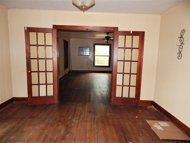 spare room with ceiling fan, french doors, crown molding, and dark hardwood / wood-style floors