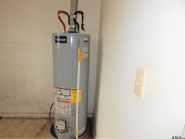 utility room with water heater