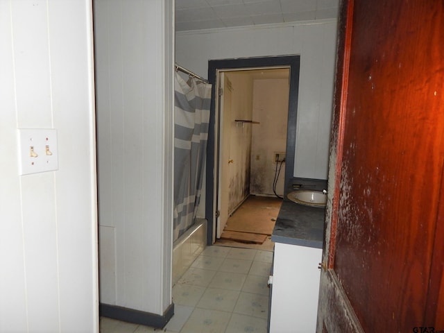 bathroom with vanity and shower / tub combo with curtain