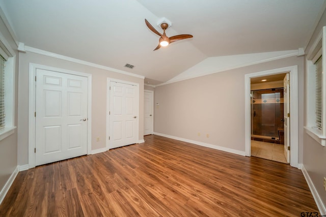 1206 Corey Dr, Whitehouse, TX 75791 - unfurnished bedroom with wood finished floors, lofted ceiling, baseboards, ensuite bathroom, and ornamental molding