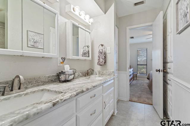 bathroom with vanity and tile patterned floors