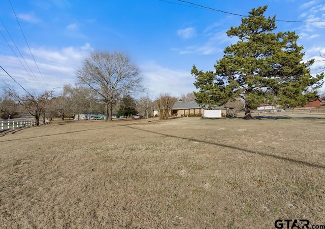 view of yard with a rural view