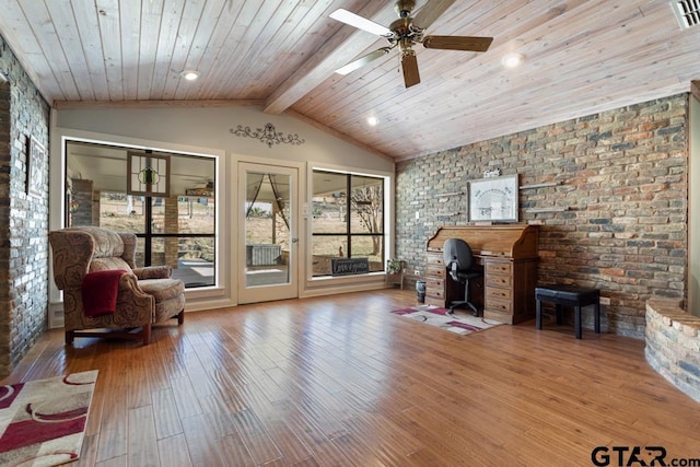 office space featuring lofted ceiling with beams, wood-type flooring, wooden ceiling, and ceiling fan