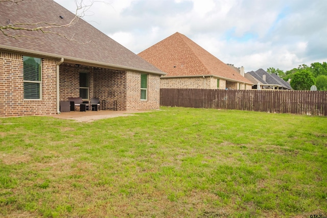 view of yard with a patio area and fence private yard