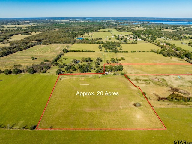 birds eye view of property with a rural view