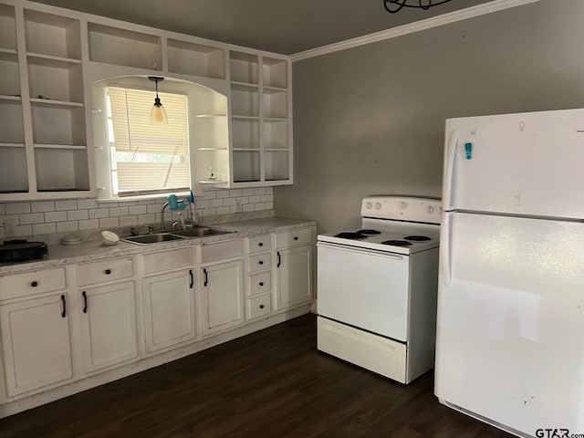 kitchen featuring white appliances, white cabinetry, sink, and decorative light fixtures