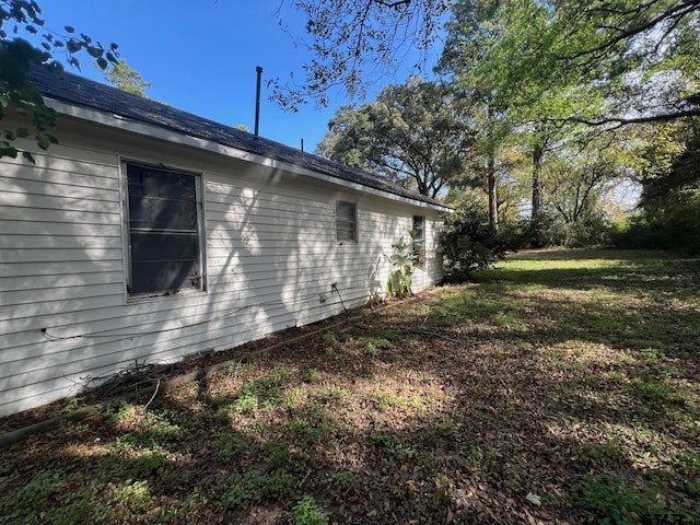 view of home's exterior with a lawn