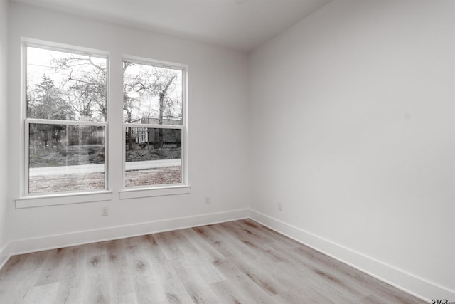 unfurnished room featuring light hardwood / wood-style flooring