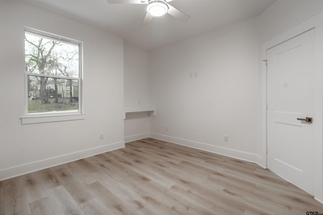 unfurnished room with light hardwood / wood-style floors and ceiling fan