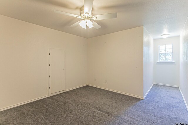 250 Autumn Wood Trl, Holly Lake Ranch, TX 75765 - unfurnished room with dark colored carpet, ceiling fan, and baseboards