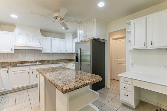 250 Autumn Wood Trl, Holly Lake Ranch, TX 75765 - kitchen with stainless steel fridge with ice dispenser, white stovetop, a ceiling fan, custom range hood, and white cabinets