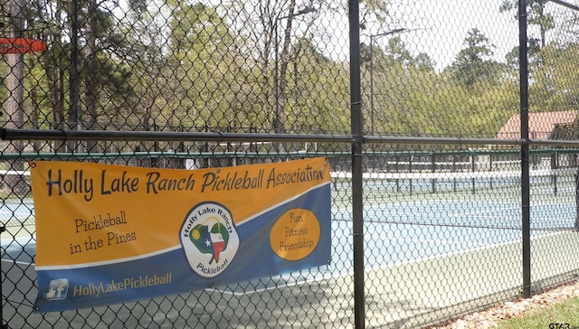 250 Autumn Wood Trl, Holly Lake Ranch, TX 75765 - view of tennis court with fence