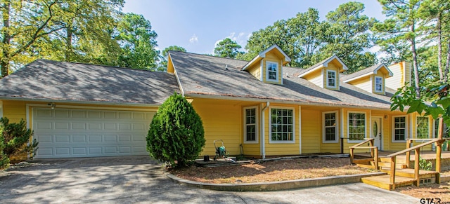 250 Autumn Wood Trl, Holly Lake Ranch, TX 75765 - cape cod home featuring an attached garage and concrete driveway