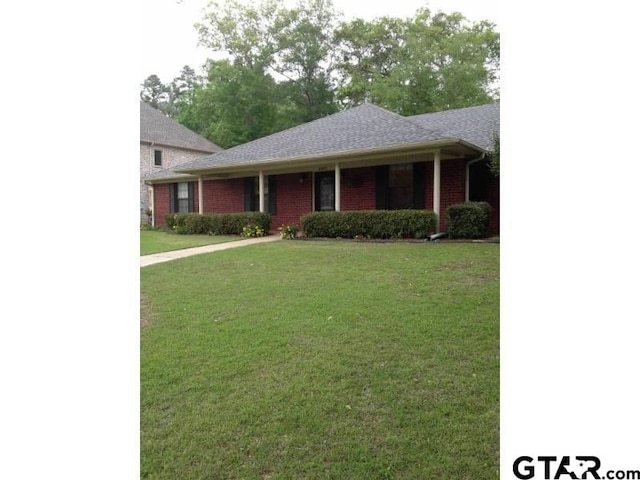 view of front of home with a front lawn