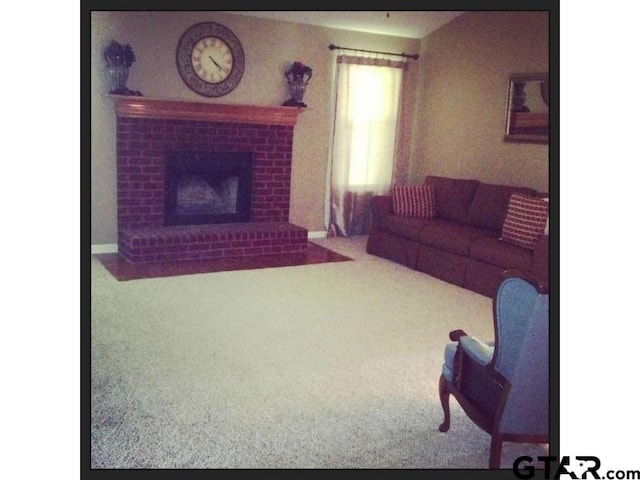 carpeted living room with a fireplace