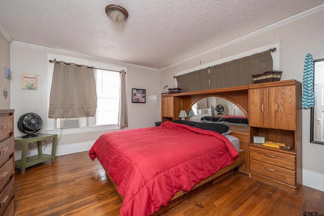 bedroom featuring a textured ceiling, dark hardwood / wood-style flooring, and ornamental molding