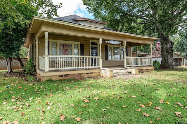 view of front of house with a porch and a front lawn