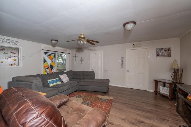 living room with wood-type flooring and ceiling fan