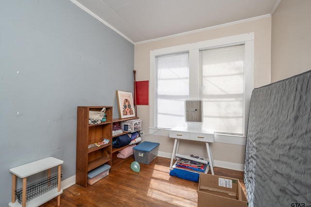 office space with wood-type flooring and crown molding