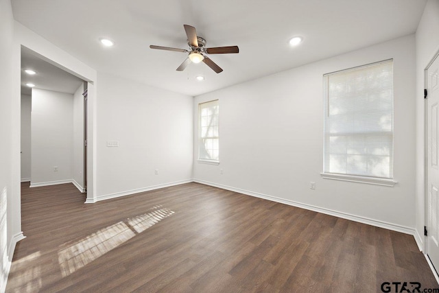 spare room with recessed lighting, dark wood-style flooring, ceiling fan, and baseboards