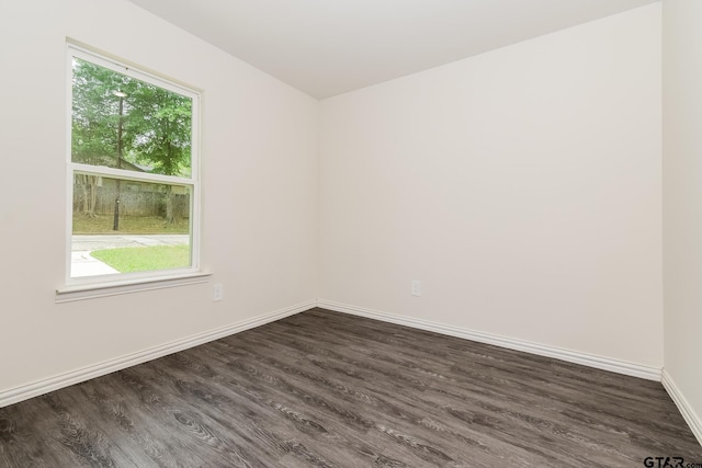 613 S Baxter, Tyler, TX 75701 - empty room featuring healthy amount of natural light and dark wood finished floors