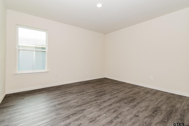 613 S Baxter, Tyler, TX 75701 - empty room with dark wood finished floors and recessed lighting