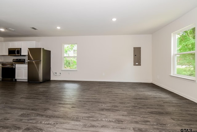 613 S Baxter, Tyler, TX 75701 - kitchen featuring stainless steel appliances, electric panel, healthy amount of natural light, dark wood finished floors, and recessed lighting