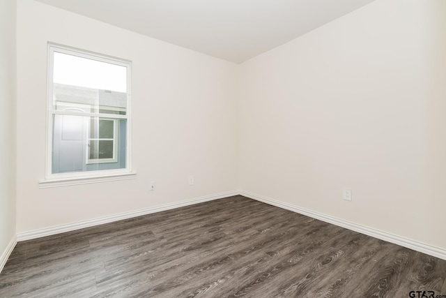 613 S Baxter, Tyler, TX 75701 - empty room with dark wood-style flooring and baseboards