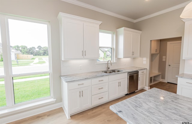 414 Bluebonnet Cir, Chandler, TX 75758 - kitchen with stainless steel dishwasher, a sink, light wood-style floors, white cabinetry, and crown molding